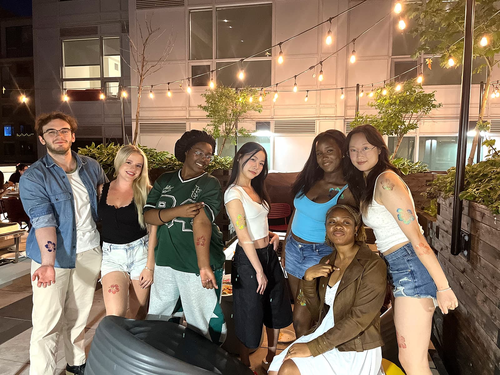 Residents posing on the rooftop patio at the ALMA ByWard Market bingo night