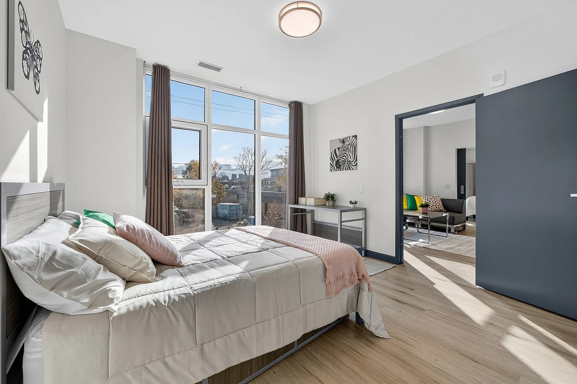 Sunlit bedroom with large windows