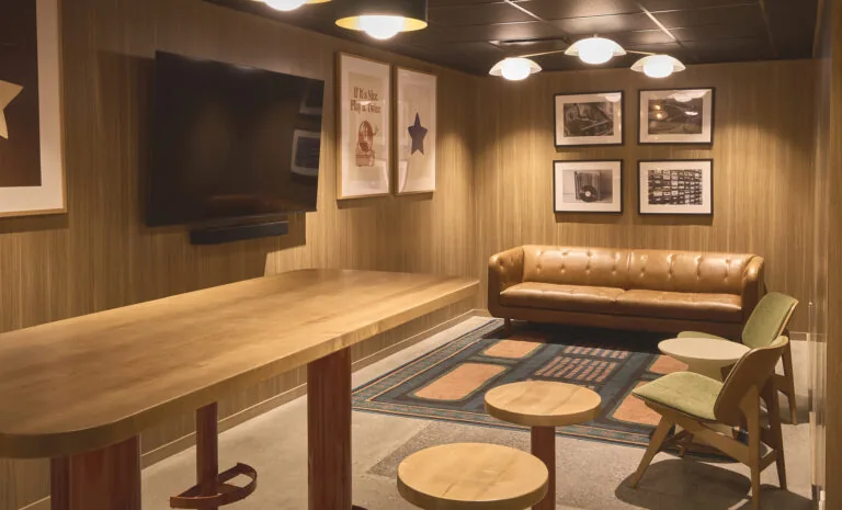 Karaoke room with lounge seating and big screen