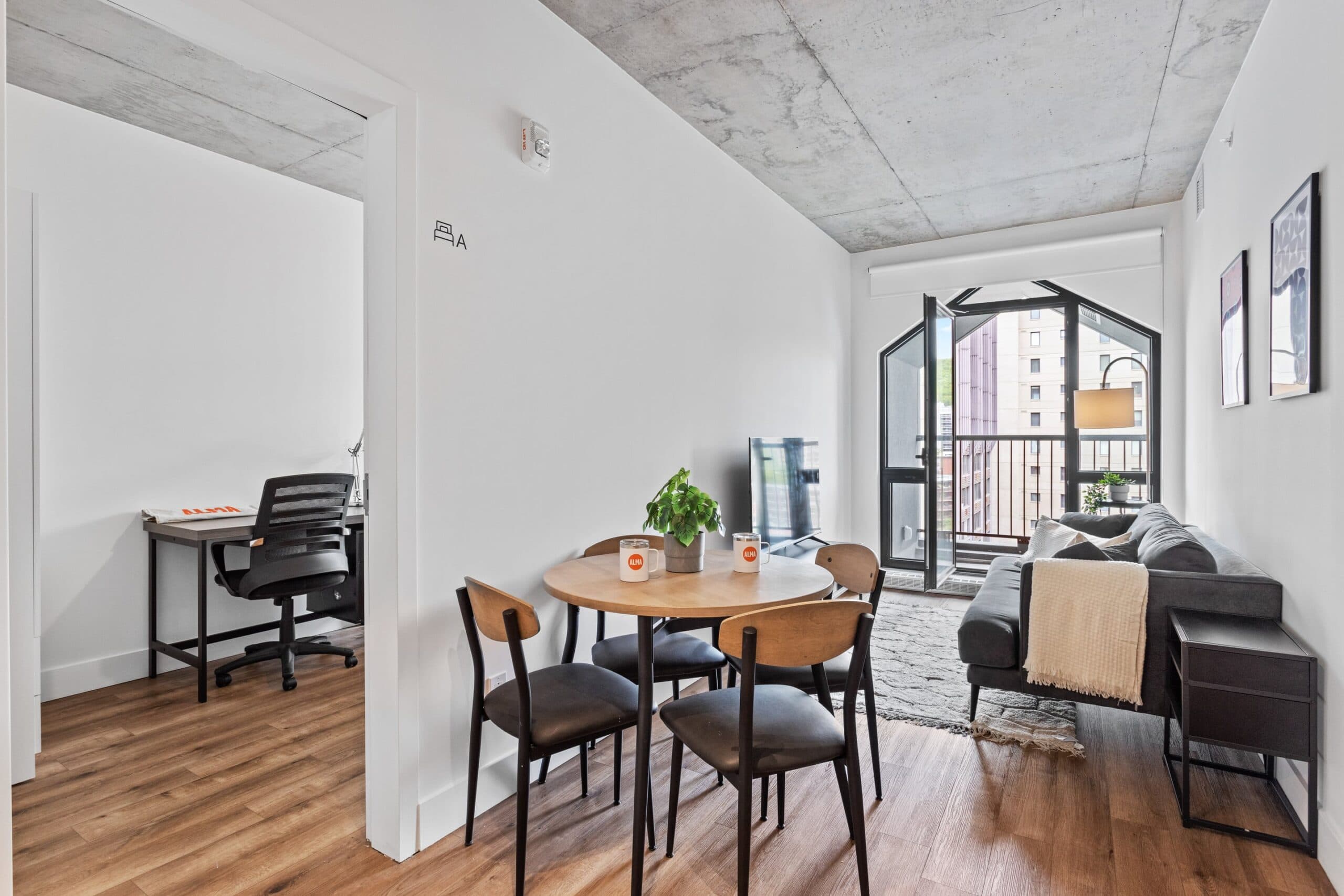 Open living and dining space with balcony access