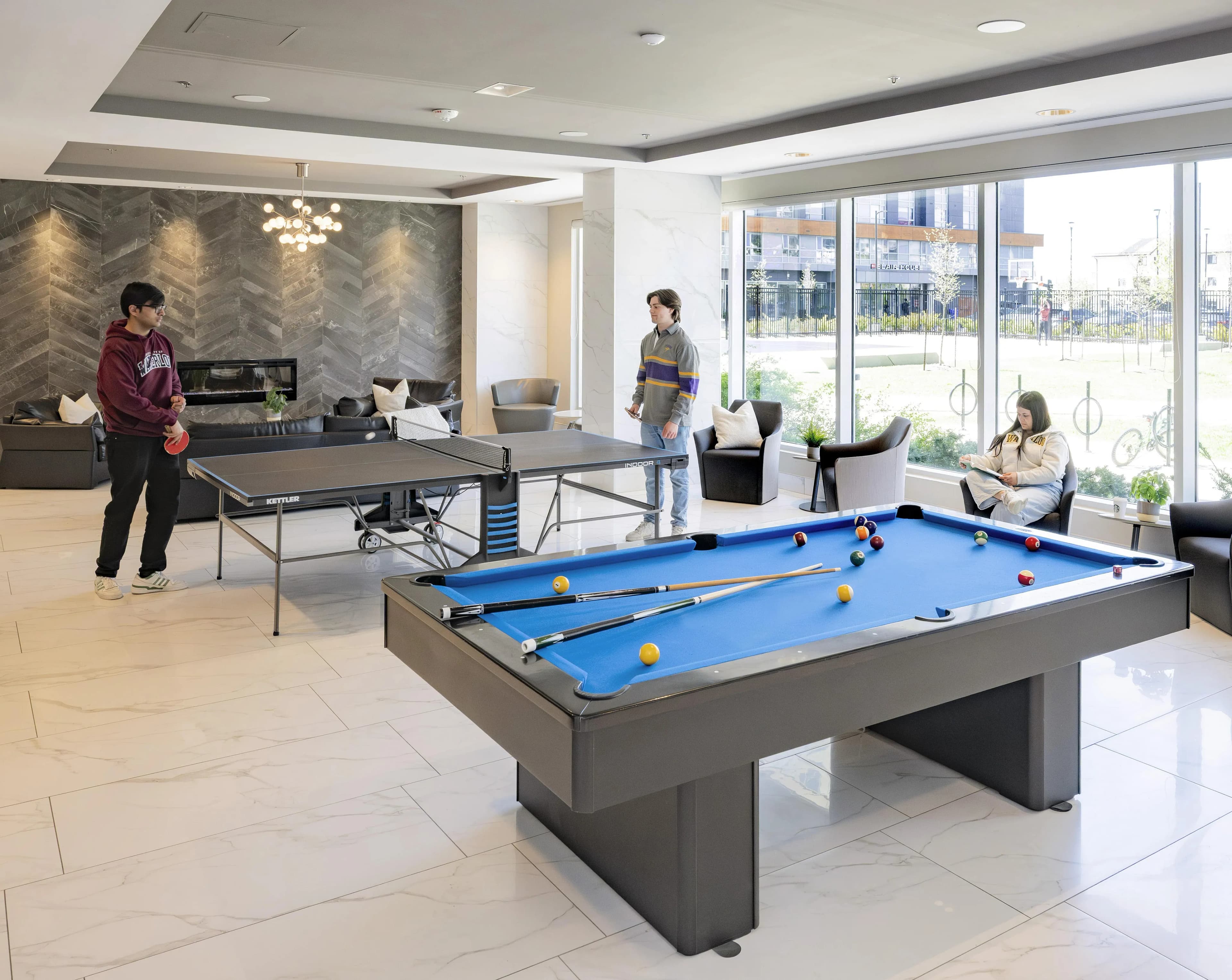 Modern lounge with billiards and ping pong tables