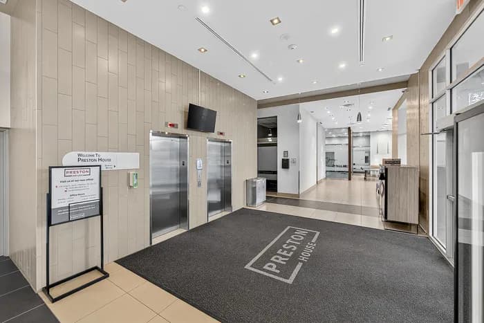 Elegant Preston House lobby featuring sleek elevators and modern design