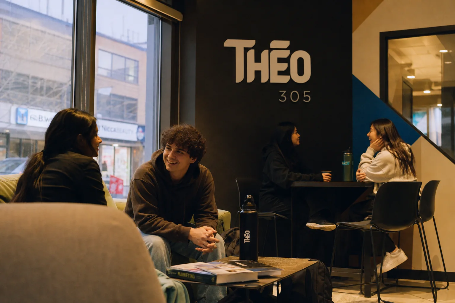 Residents in the Theo 305 lobby lounge